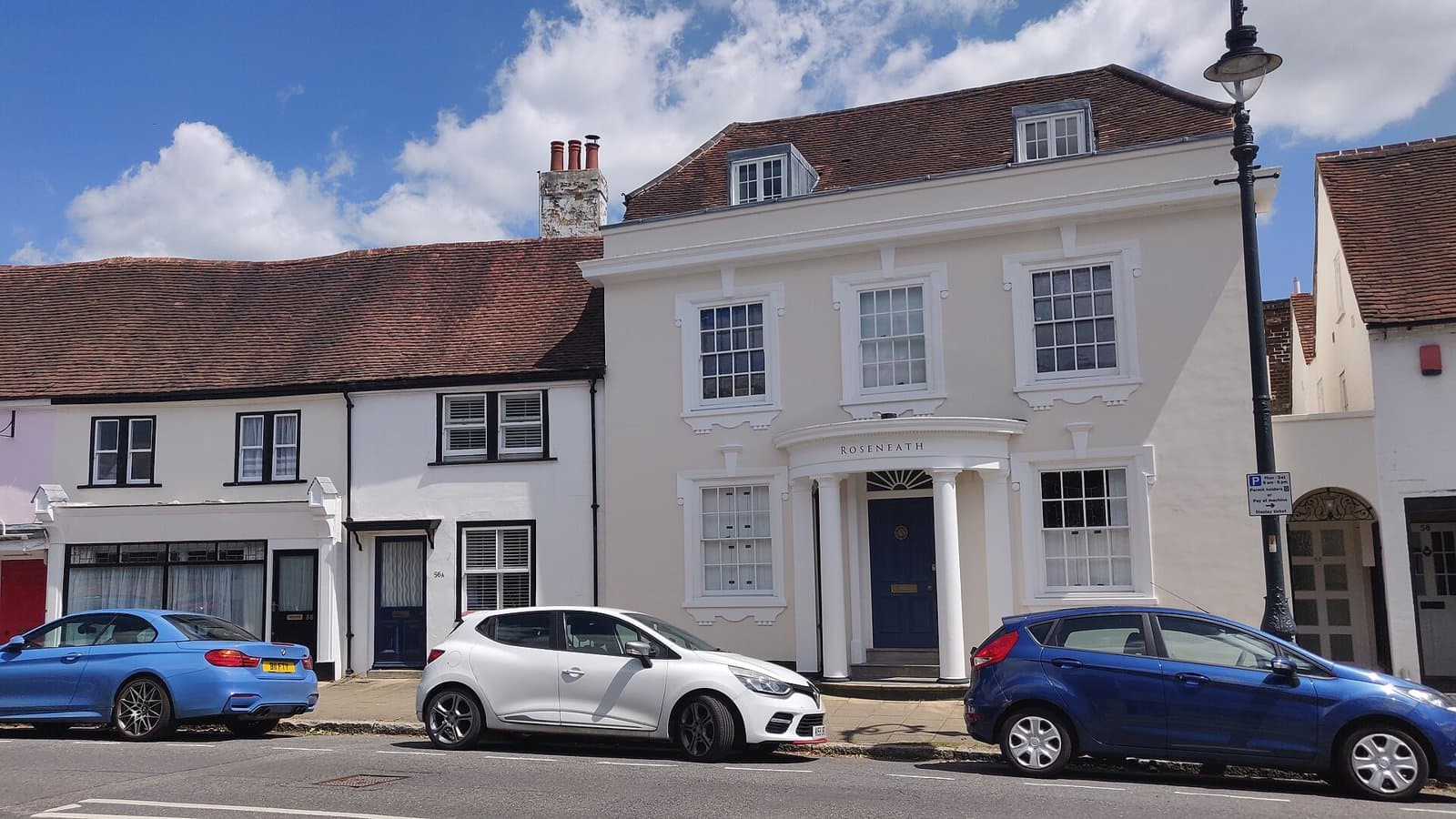 Georgian house Roseneath with a columned porch among older buildings on High Street, Fareham