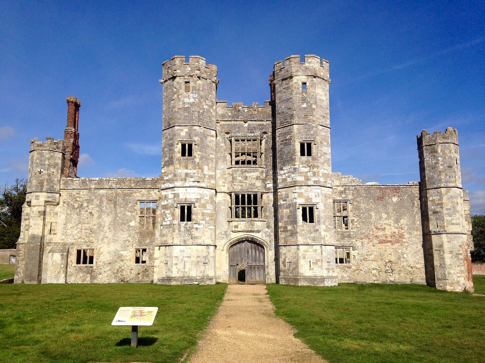 The Tudor gatehouse of Titchfield Abbey (Place House) with towers and a gravel path, Titchfield, Fareham
